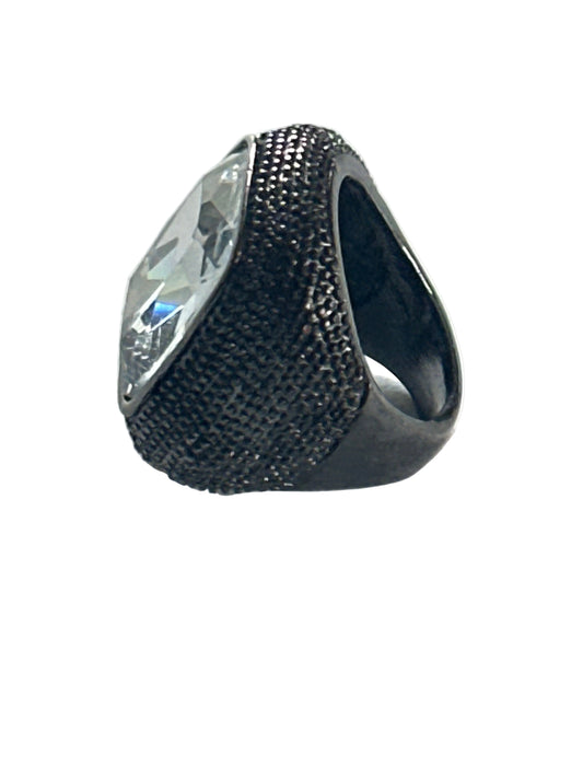 Silver-tone ring with a striking stone
